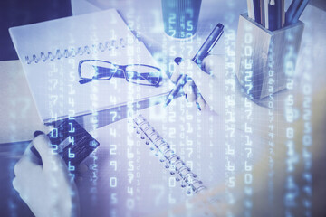 Double exposure of woman on-line shopping holding a credit card and data theme hologram drawing. E-commerce concept.