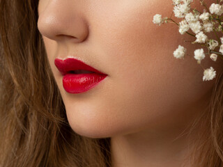 Close-up of woman's lips with fashion bright pink make-up. Beautiful female mouth, full lips with...