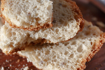 Pieces of broken bread. Homemade bread, fresh pastries in the bakery