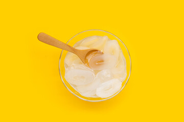 Toddy palm in syrup on yellow background.