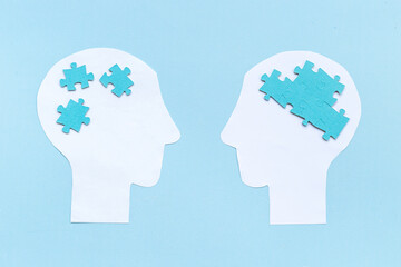 Brain puzzles on two human heads. Communication and connection concept