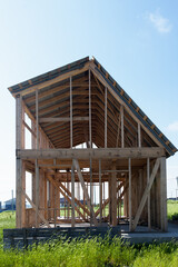 Obraz premium Construction of a wooden frame house