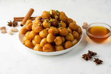 Sweet dessert Luqaimat, fried dough balls. Arabic sweetness