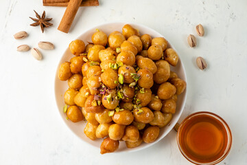 homemade luqaimat, traditional dessert top view, free space.