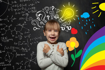 Funny young kid girl on blackboard background with science and arts pattern. Creativity education,...