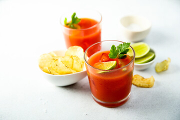 Homemade tomato cocktail with fresh lime