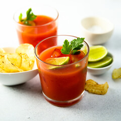 Homemade tomato cocktail with fresh lime