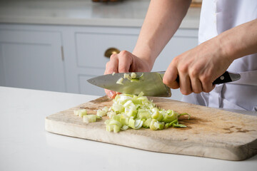 A Teenage Boy Cooking In A Kitchen