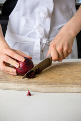 A Teenage Boy Cooking In A Kitchen