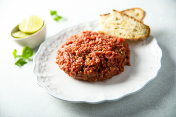 Homemade steak tartare served with bread