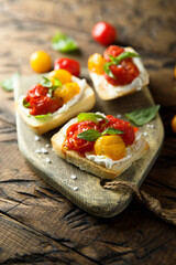 Tomato crostini with cream cheese and fresh basil	