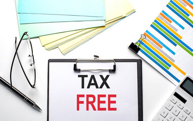 TAX FREE text on paper sheet with chart,color paper and calculator