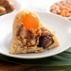 Zongzi. Rice dumpling for Dragon Boat Festival on bright marble table background with ingredient.