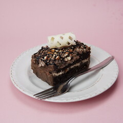 Hazelnut Pastry with Fork In White Plate