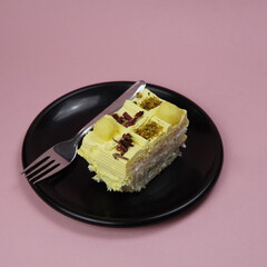Rasmalai Pastry In Black plate With Fork      