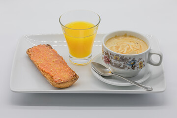 Porcelain tray with breakfast of coffee with milk, toast and orange juice isolated on a white background