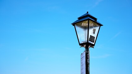 Fototapeta na wymiar Street lamp on sky background