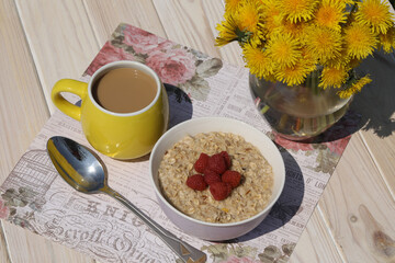 breakfast oatmeal with raspberries and milk