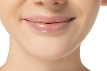 Cropped close-up image of plump female lips isolated over white background. Cosmetology injection,...