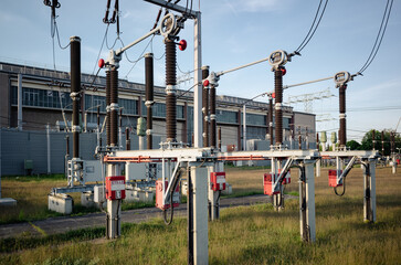 Electrical substation transforming voltage from high to low.