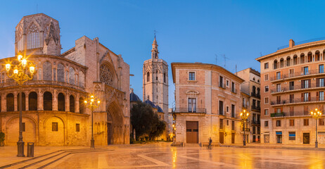 Fototapeta na wymiar Valencia - The square Plaza de Mare de Deu with the Cathedral in the morning light.