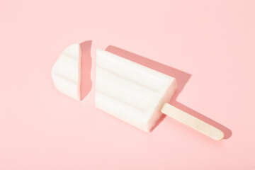 Vanilla ice cream on a stick on a pink background. Vector illustration.