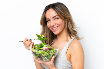 Young caucasian woman isolated on white background holding a bowl of salad with happy expression