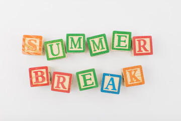 An arrangement of children painted alphabet wooden blocks spelling out 