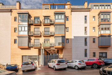 Facades of urban residential houses in a street in Madrid