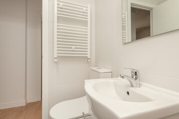 toilet with white wooden bathroom cabinet with frameless mirror, shower cabin with screen and wall...