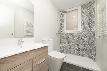 wc with wooden bathroom cabinet with frameless mirror attached to the wall, shower cabin with...