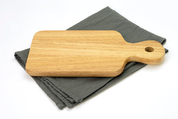 Empty wooden tray with cloth isolated on white background. Mock up. Selective focus.