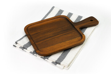 Empty wooden tray with cloth isolated on white background. Mock up. Selective focus.