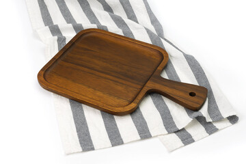 Empty wooden tray with cloth isolated on white background. Mock up. Selective focus.