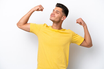 Fototapeta premium Young caucasian man isolated on white background doing strong gesture
