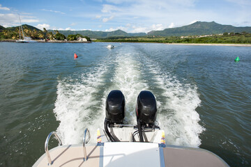 Two powerful engines at the stern of a boat or yacht.