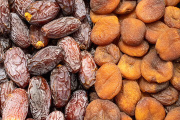 Dates fruit and dried apricots. healthy foods. Close-up.