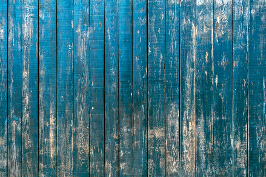 Old blue painted rustic wooden planks wall background, grunge distressed texture