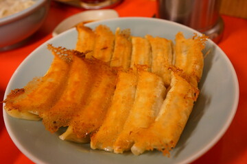 Yaki Gyoza or Grilled Dumplings Snack with soy sauce - 焼き餃子 醤油