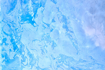 Blue ink abstract background, winter paint pattern under water, acrylic pigment stains, splashes and streaks