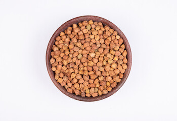 chickpeas (Bengal Gram) in rock bowl on white background. Close up of Organic chana or chickpea (Cicer arietinum). for design and banner. top view chickpeas.