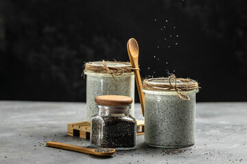 Obraz na płótnie Canvas Healthy breakfast. Chia seed pudding. Yogurt with chia seeds healthy superfood. Cottage cheese smoothie in glass jars. place for text