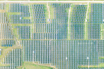Solar farm, field or solar power plant in aerial view consist of photovoltaic cell in panel, landscape, technology. Industry for electric, electricity generation. Clean green power energy from nature.