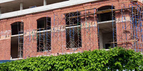 A construction works on the construction site of a building.