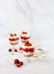 Berry dessert in glass with fresh strawberry, biscuit and whipped cream. Vegan lactose free dessert...