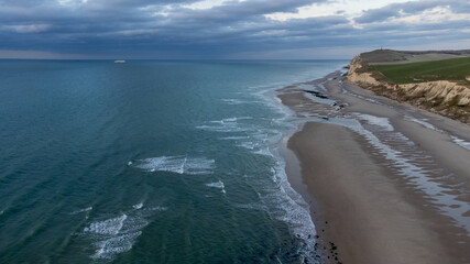 Aerial drone shot of a Seascape of the opal coast of Cap Blanc Nez, showing the Monument at Cape white Nose France on top of the chalk cliffs. High quality photo