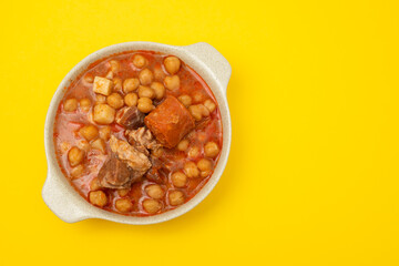 chick pea with smoked sausages in white bowl