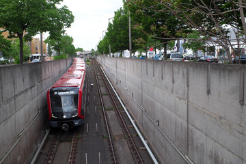 Nuremberg, Bavaria, Germany - May 15, 2022: Subway leaves the station and goes into the tunnel