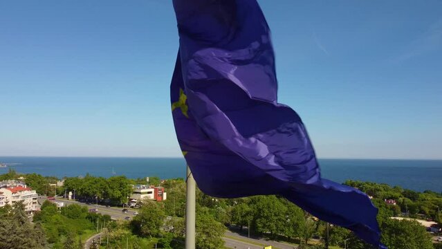 European union flag Against City at summer day	
