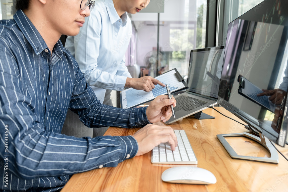 Aufkleber Business trader team checking stock market online analyzing graph data on laptop screen to brainstorming about trading online while working together in office